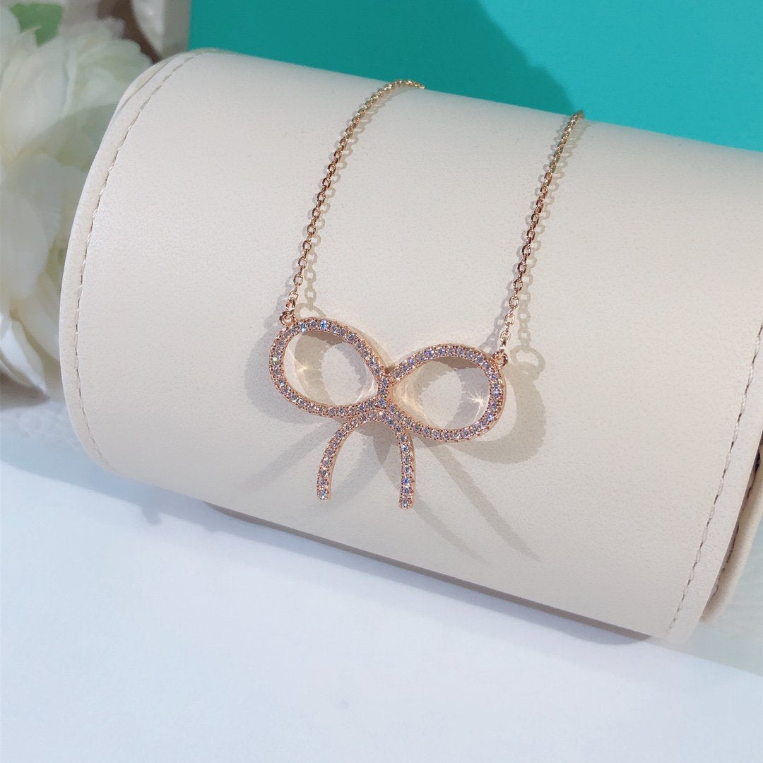 [Glow Muse ]CLAW SET RHODIUM PLATED BOW NECKLACE