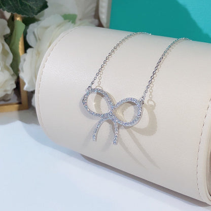 [Glow Muse ]CLAW SET RHODIUM PLATED BOW NECKLACE